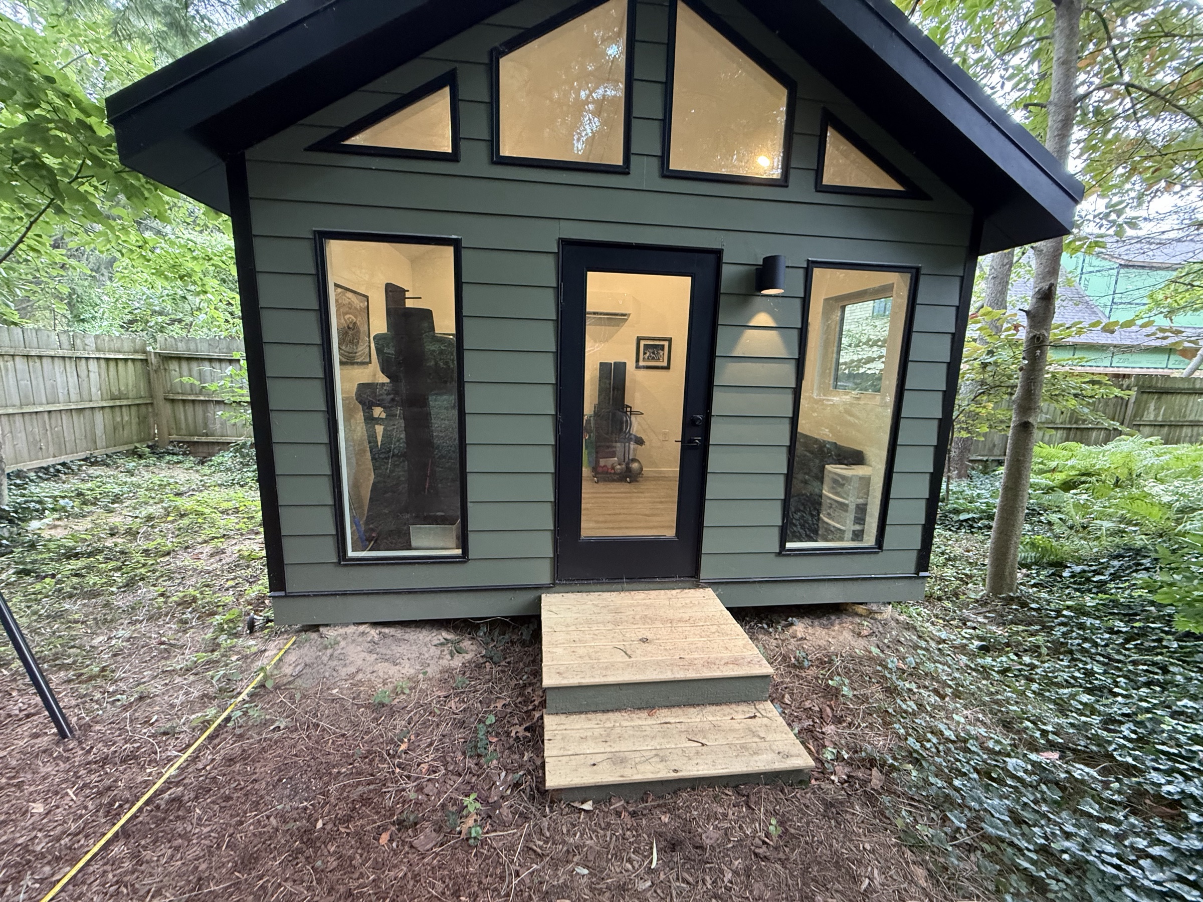 New Buffalo outdoor entry before the Lake & Oak deck project, with a small set of wood steps
